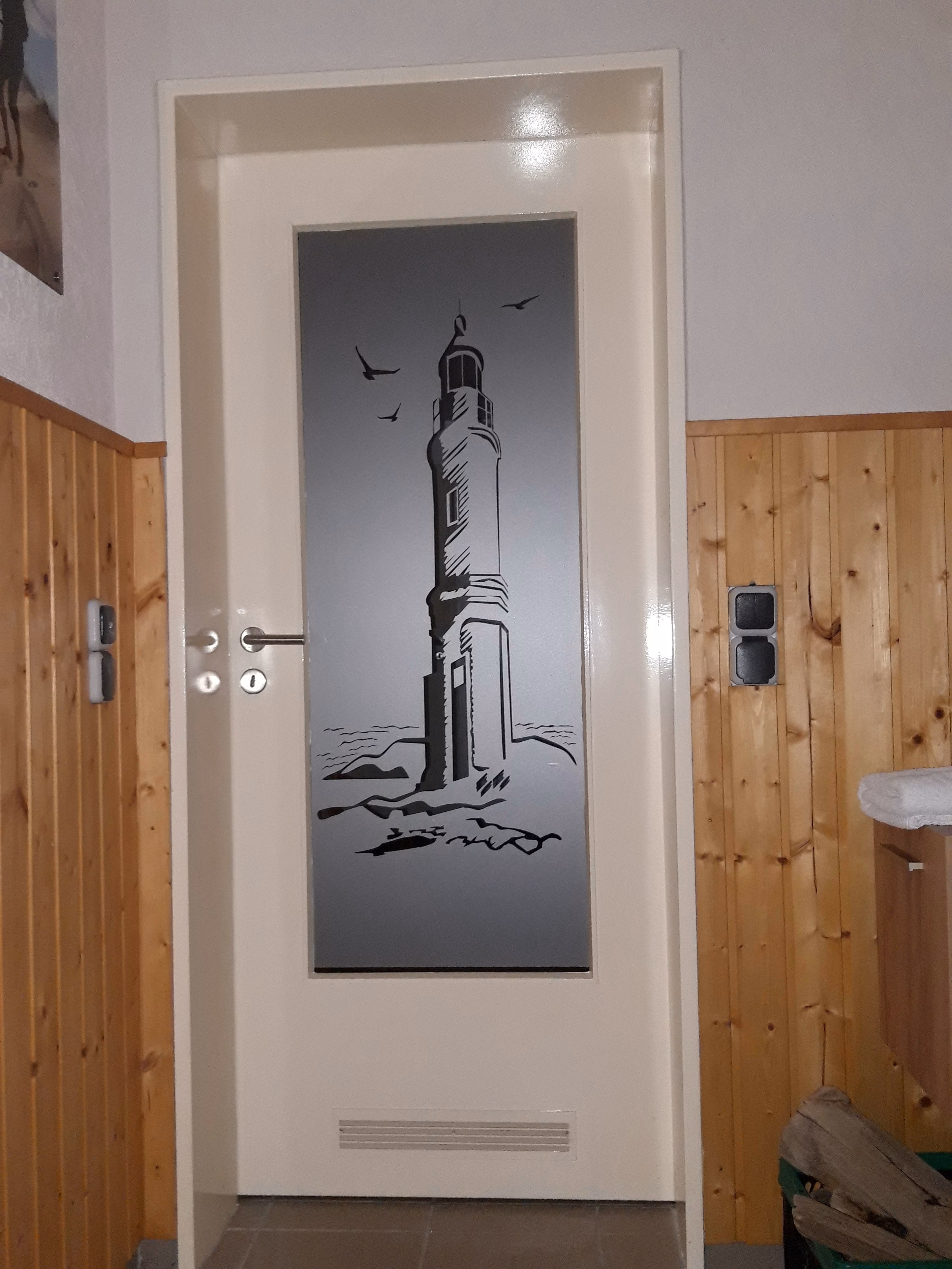 Tür Glasdekor Leuchtturm am Meer